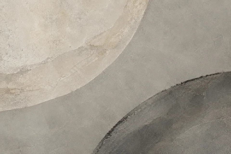 Curved mineral layers meet along worn and irregular edges.
