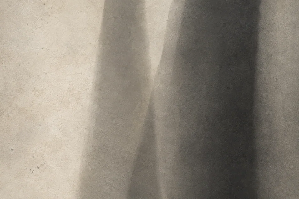 Soft vertical shadows overlap in bone, taupe and charcoal.